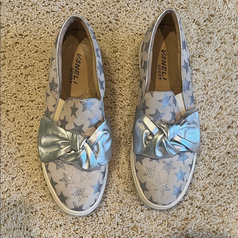 Vaneli Metallic Silver Star Slip-Ons with Knot Accent